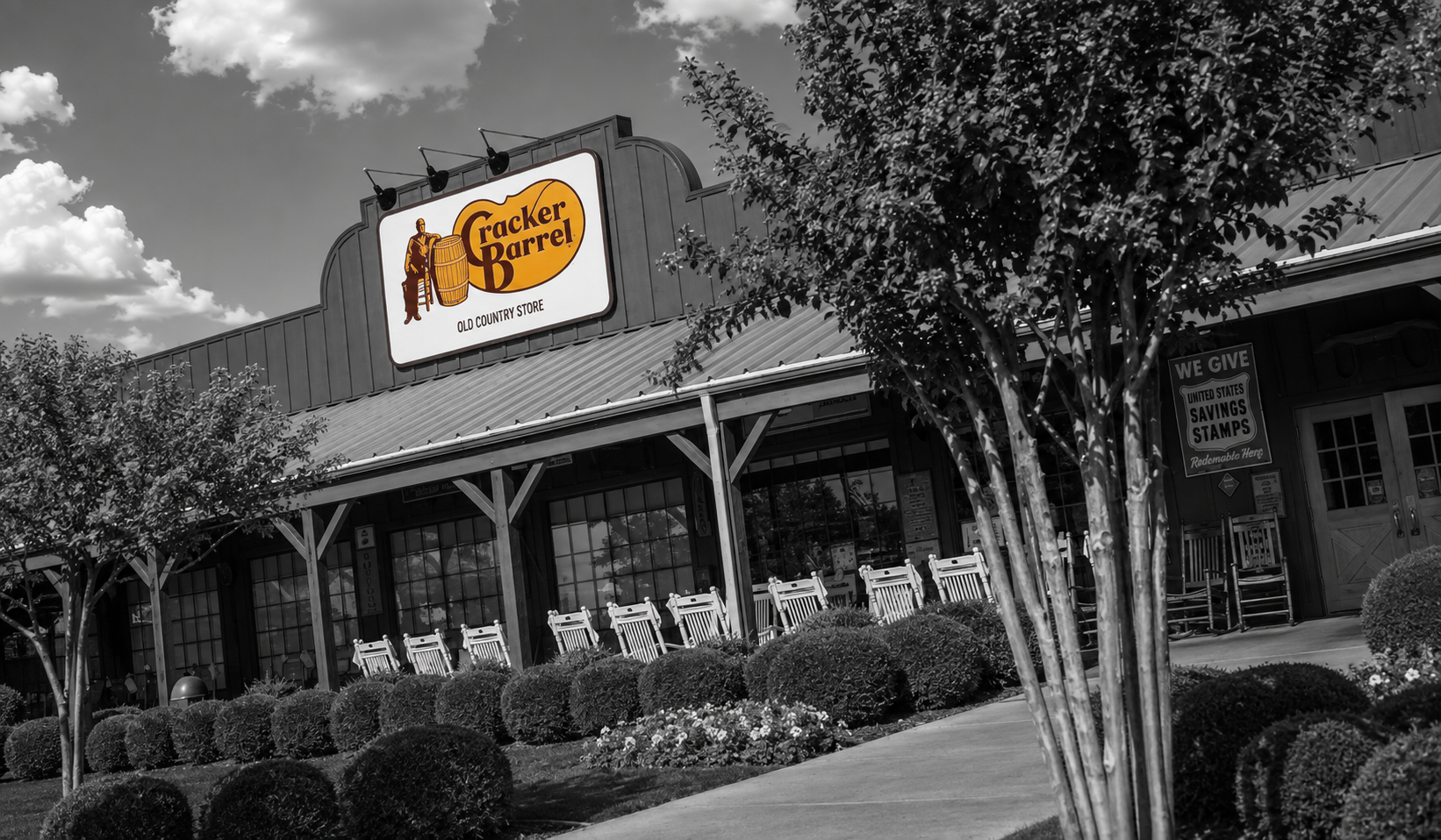 A quiet Cracker Barrel exterior with an amber-lit entrance.